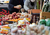 People shop for groceries at the traditional market in Mangwon-dong, western Seoul, on Thursday. Based on a household of four, the cost to buy groceries to prepare for the ancestral rites for the Lunar New Year holiday has risen 4.1 percent to 254,500 won compared to 2022, according to Korea Price Information. [YONHAP]