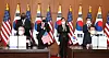 Jeong Eun-bo, right, Korea’s top negotiator for the defense cost-sharing negotiations, and Rob Rapson, the acting U.S. ambassador to Seoul, initial the Special Measures Agreement at a signing ceremony at the Foreign Ministry in central Seoul Thursday. U.S. Defense Secretary Lloyd Austin and Secretary of State Antony Blinken and Korea’s Foreign Minister Chung Eui-yong and Defense Minister Suh Wook watch on after their two-plus-two meeting. [JOINT PRESS CORPS]