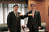 Foreign Minister Park Jin, right, and his Japanese counterpart, Yoshimasa Hayashi, bump elbows during a meeting at a hotel in New York on Monday. [JOINT PRESS CORPS]