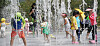 Children play in a fountain to cool themselves off in Ulsan on Monday, as a heat wave hits much of the country. [NEWS1]