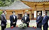 President Moon Jae-in, center, and leaders of the four largest business groups talk before a Blue House luncheon on Wednesday. From left, LG Chairman Koo Kwang-mo, SK Chairman Chey Tae-won, Moon, Hyundai Motor Chairman Chung Eui-sun and Samsung Electronics Vice Chairman Kim Ki-nam. [YONHAP]