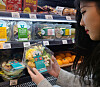 A customer picks up a salad product that contains collagen at an Emart24 store in downtown Seoul. [EMART24]