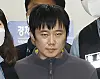 Jeon Joo-hwan, the 31-year-old suspect in the subway murder case, is transferred from Seoul Namdaemun Police Station to the Seoul Central District Prosecutors Office on Wednesday. [NEWS1]