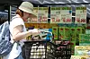 A consumer shops for processed foods on a street in Myeong-dong, central Seoul, on June 1. According to the Statistics Korea data portal, prices of processed food products rose 4.1 percent in April compared to the same month last year. [NEWS1]