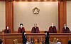 Constitutional Court President Yoo Nam-seok and other justices take their seats ahead of ruling on the constitutionality of laws weakening the prosecution's investigative powers at the court in Jongno District, central Seoul, Thursday afternoon. [JOINT PRESS CORPS]