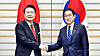 Korean President Yoon Suk Yeol, left, and Japanese Prime Minister Fumio Kishida shake hands during their summit at the prime minister's residence in Tokyo Thursday. [JOINT PRESS CORPS]