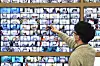 A National Election Commission (NEC) official monitors early voting ballot boxes for the March 9 presidential election from the election watchdog’s control center in Gwacheon, Gyeonggi, Monday. [NEWS1]