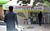 People walk into a Covid-19 testing center in Daegu on Sunday. [KIM SUNG-TAE]