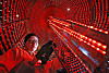 Architect-artist Han Won-suk works on connecting the speakers and amplifiers inside a gigantic Emille Bell-inspired artwork made from 3,088 discarded speakers at his studio in Busan. [PARK SANG-MOON]