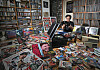 Pop music critic Choi Kyu-sung examines his collection of LPs, CDs, cassette tapes, songbooks, posters and more at the K-pop Database & Research Institute in Jori-eup in Paju, Gyeonggi. [PARK SANG-MOON]