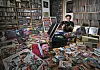 Pop music critic Choi Kyu-sung examines his collection of LPs, CDs, cassette tapes, songbooks, posters and more at the K-pop Database & Research Institute in Jori-eup in Paju, Gyeonggi. [PARK SANG-MOON]
