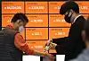 A Bithumb employee checks a visitor's temperature at its office in Gangnam District, southern Seoul, on Thursday. Cryptocurrency exchanges, which have shut down their customer centers due to the Covid-19 pandemic, have been reopening amid the cryptocurrency boom in Korea. [YONHAP]