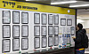 A job-seeker checks postings on a job board at an Employment Welfare Plus Center in Seoul on Feb. 10. [YONHAP]