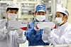 Employees work on a production line at LG Chem’s electric vehicle battery plant in Ochang, North Chungcheong. [LG CHEM]