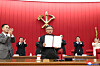 North Korean leader Kim Jong-un holds up a document signed by him to applause from participants in the third plenary session of the eighth Central Committee of the North’s ruling Workers' Party Thursday, reported its official Korean Central News Agency Friday. The document is thought to be a special order signed off by Kim during the meeting which could address issues like food shortage. [YONHAP]