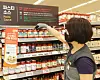 An employee displays pasta sauces at Emart’s Seougsu branch in eastern Seoul. At Emart, some 100 different pasta sauces are available so far. [EMART]