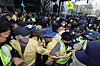 Officials from the Daegu Metropolitan Government and Daegu’s Jung District Office, left, clash with police officers on Saturday as they attempt to stop an LGBTQ festival from being held. [NEWS1]