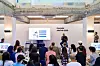 A Hyundai Motor employee talks to attendees at the Global Team Hyundai Talk that took place in Seoul on Sunday. [HYUNDAI MOTOR]
