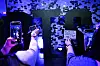 K-pop fans take pictures of their notes written on stickers posted on a wall as they visit a BTS pop-up store to promote the album 'Proof' in Los Angeles on June 15. K-pop supergroup BTS announced on June 14 they were taking an indefinite break to focus on solo activities. [AFP/YONHAP]