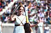 The Olympic flame is passed to the 2024 Gangwon Youth Olympics torch at the Panathenaic Stadium in Athens. [HELLENIC OLYMPIC COMMITTEE]