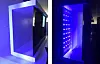 Left: A mock-up of the inside of LG's OLED TV, which displays images with organic light-emitting diodes. Right: A mock-up of Samsung's QLED TV, which requires a backlight for the LCD panel to display images. [KIM YOUNG-MIN]
