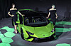 Models pose with the Lamborghini Huracán Tecnica sports car [AUTOMOBILI LAMBORGHINI]