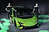Models pose with the Lamborghini Huracán Tecnica sports car [AUTOMOBILI LAMBORGHINI]