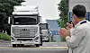 Workers at Hyundai Motor's Jeonju plant in North Jeolla celebrate as the world's first mass-produced hydrogen-powered commercial vehicles, Xcient Fuel Cells, leave to be shipped to Switzerland. [HYUNDAI MOTOR]