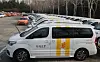 A large Kakao taxi sits in the parking lot of a taxi company in Seoul in February 2020. The government has decided to allow companies to provide app-based cab-sharing services from the first half of 2021. [YONHAP]