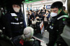 Members of the Solidarity Against Disability Discrimination board a subway train at Samgakji Station in central Seoul on Tuesday as part of a protest demanding more spending on people with disabilities. [YONHAP]