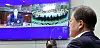 President Moon Jae-in, right, exchanges greetings with Seoul Mayor Oh Se-hoon, shown left in the screen hung on the wall, during the video conference cabinet meeting on Tuesday. Moon joined the meeting from the Blue House, while Oh and some other ministers joined from the government complex buildings in Seoul and Sejong. [YONHAP]