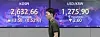 Screens in Hana Bank's trading room in central Seoul show stock and foreign exchange markets open on Thursday. [YONHAP]