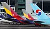 Korean Air Lines and Asiana Airlines' planes are stationed at Incheon International Airport. [YONHAP]