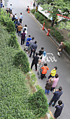 People wait in line to apply for the government’s Covid-19 relief payments Monday at a welfare center in Daegu. [NEWS1]