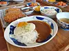 Homemade pork cutlet served with curry, rice and a fried egg. [PAIK JI-HWAN]