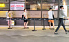 Customers keep a distance while waiting for a seat at a restaurant in Seoul on Monday. As the number of new cases continues to remain above 200, stricter social distancing regulations have been implemented. [YONHAP]