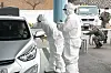 Quarantine officials administer Covid-19 tests for military officers at a drive-through testing station at the Defense Ministry in Yongsan District, central Seoul, on Tuesday after the first coronavirus case at the Joint Chiefs of Staff (JCS) was reported earlier in the day. [YONHAP]