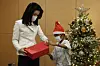 First lady Kim Keon-hee gives a present to Aok Rotha during her visit to Asan Medical Center in Songpa, southeastern Seoul, on Wednesday where the 14 year-old Cambodian child is recovering from heart surgery. The boy met with the Korean first lady at his home when she visited Phnom Penh while accompanying President Yoon Suk-yeol. [PRESIDENTIAL OFFICE]