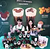 Starbucks employees showcase products from their collaboration with Walt Disney Company Korea at the Starbucks Press Center in central Seoul on Monday. From Tuesday, Starbucks will be selling exclusive collaborative food, beverages and merchandise featuring Disney characters like Mickey and Friends and Chip and Dale, only available in Korea. [STARBUCKS KOREA]