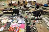 In this file photo, staff members organize counterfeit items from China seized by customs authorities at a port in Busan, some 330 kilometers south of Seoul, on Jan. 9. [YONHAP]