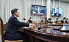 President Moon Jae-in, left, participates in a videoconference with Moderna CEO Stéphane Bancel on Monday at the Blue House. [YONHAP]