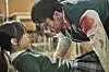 A scene from Netflix Korea's original series 'All of Us Are Dead' where one of the main protagonists On-jo (played by actor Park Ji-hu) stares in disbelief at a student-turned-zombie in the cafeteria. [NETFLIX]