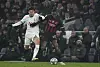 Tottenham's Son Heung-min, left, and AC Milan's Rafael Leao in action during a Champions League round of 16 second leg match at Tottenham Hotspur Stadium in London on Wednesday. [AP/YONHAP]