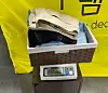 A scale at the 'kilo shop' Gram Deal shows clothes weighing 1,560 grams that cost about 45,000 won. [YOO JI-YOEN]