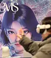A visitor uses a VR device to watch SM Entertainment's concert at the AI Content Festival 2025 on Dec. 4 at Coex in southern Seoul. [NEWS1]