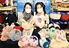 Models pose with winter products at Lotte Mart's Seoul Station branch in Jung District, central Seoul, on Monday. Ahead of this winter's cold wave, Lotte Mart said it offers customer various winter products such as earmuffs and fur shoes at up to 50 percent off through Jan. 13. [YONHAP]