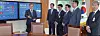 President Moon Jae-in converses with his aides in front of the electronic bulletin board on jobs in his office on Jan. 20, 2018, eight months after coming into office.