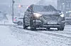 An image of a car driving on a snowy day [GETTY IMAGES BANK]