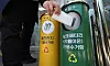 A passerby throws out a lithium-ion power bank at its dedicated recycling bin installed at the Daemyung 9-dong Administration & Welfare Center in Nam District in Daegu on Wednesday. [YONHAP]
