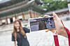 SK Telecom's Changdeok ARirang app allows visitors to take augmented reality (AR) photos with 3-D figures in the palace. [SK TELECOM]
